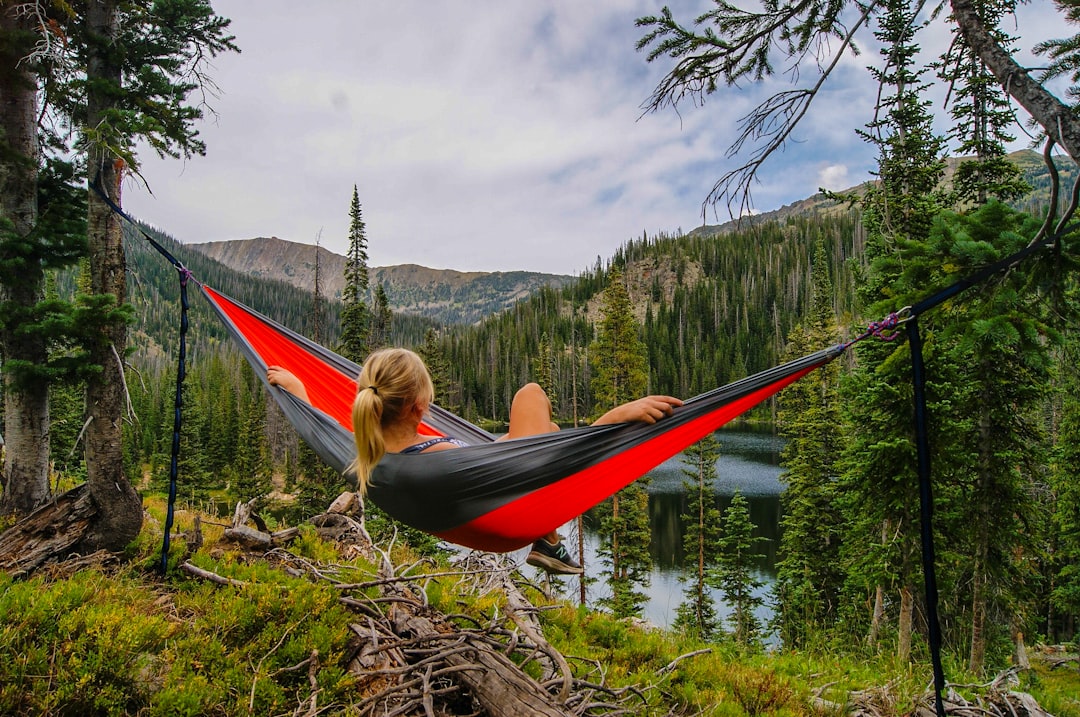 woman-on-hammock-near-to-river-kytt8l5jlds
